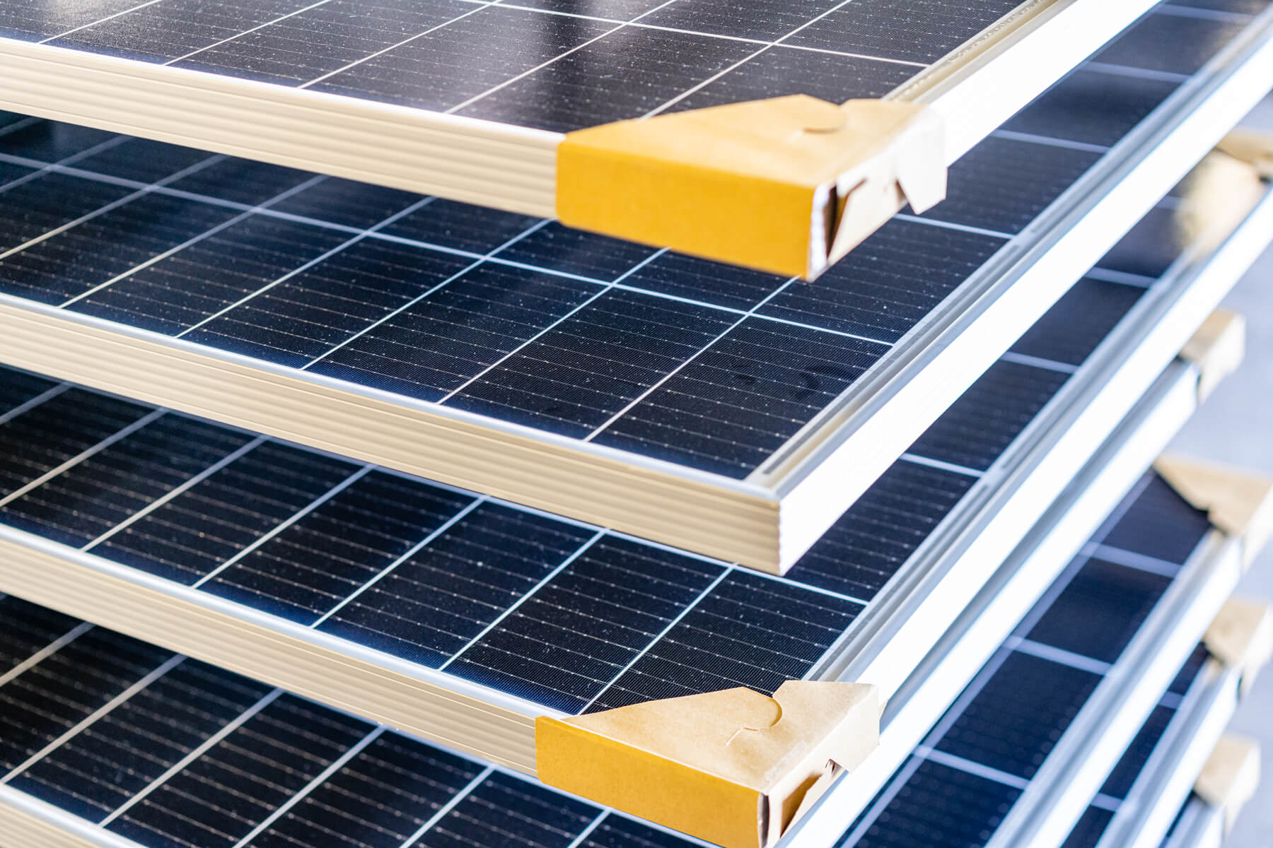 A close up of three solar panels with yellow straps